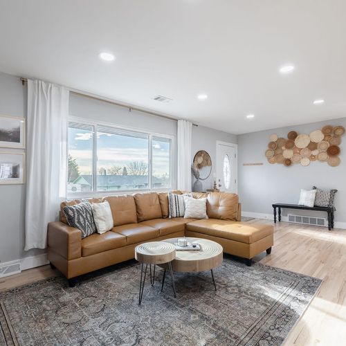 - natural sunlight pouring through the large picture window as you unwind on the leather sectional
- enjoy curated wall art & earthy textures that create a calming, stylish atmosphere
- lounge, read, or gather with friends in this spacious open conce