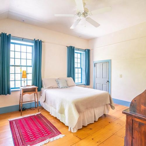 2nd floor guest bedroom with queen sized bed.