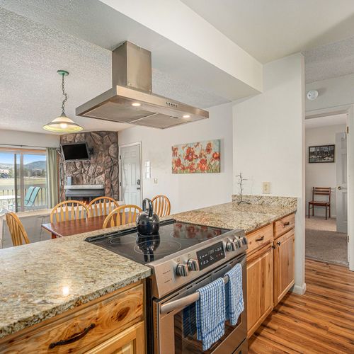 Granite countertops and modern appliances bring function and elegance to your cooking space.