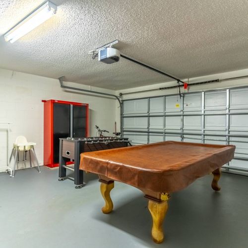 Game room with pool table and foosball