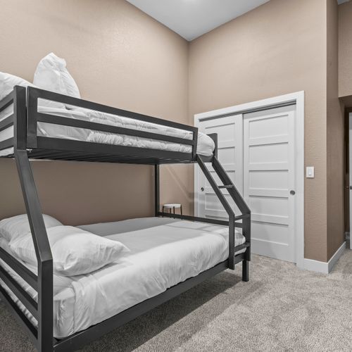 Rest easy in plush bunk beds with smart storage and carpeted comfort.
