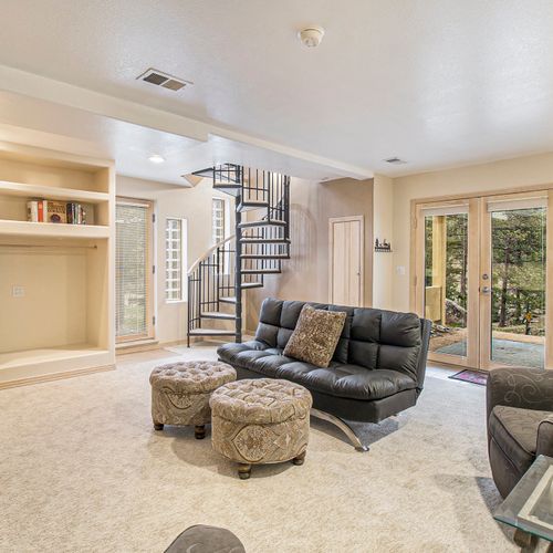 Lower level comfort with soft light and relaxing vibes.