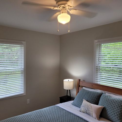 Bedroom #2:  bedroom #2 features a queen-size bed, ceiling fan, dresser, matching nightstands with lamps, and a closet.