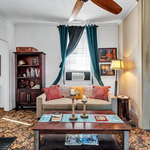 Bright, cozy living room full of classic NOLA charm.