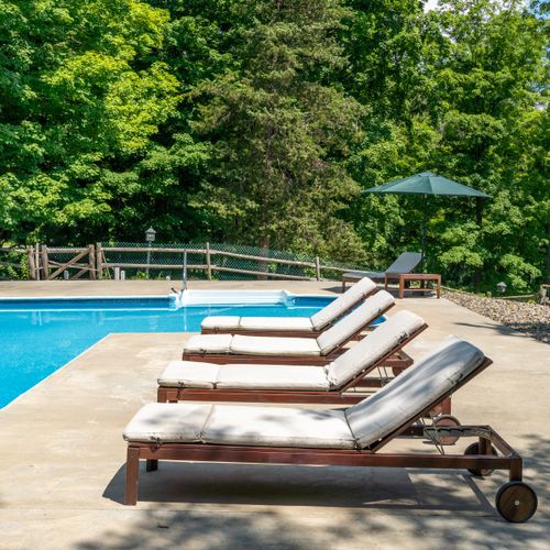 Enjoy a dip in the pool, surrounded by trees and under the open sky.