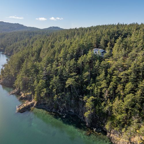 Waterfront adventures.  Follow our winding trail down through five private acres to a private sandy beach and rock outcrop.