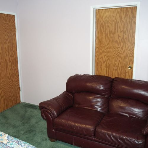 Bedroom #3:  another view showing the cushy and comfortable sofa along with the bedroom door (on the left) and the bedroom closet (on the right). Note that the bedroom closet is used for storage and is not available for guest usage.