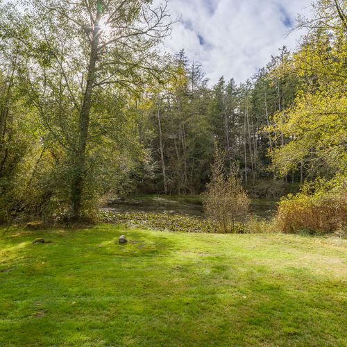 Explore the edges of the pond and the surrounding seven acres of woods.