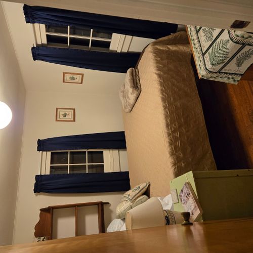 Bedroom #2:  features a full-size bed, nightstand, lamp, and dresser.