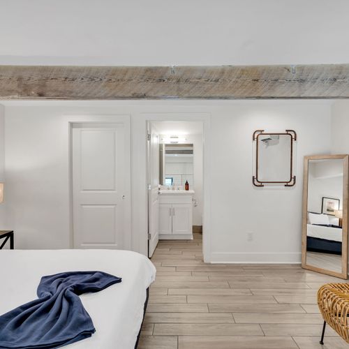 Clean, well-lit bathroom w/ modern fixtures & plenty of space.