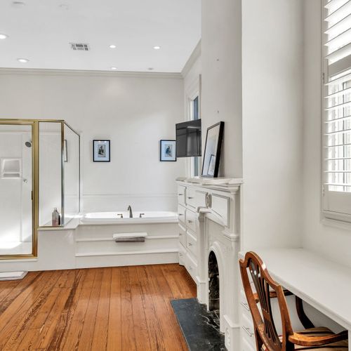 Spacious bathroom with a luxurious soaking tub and classic accents.