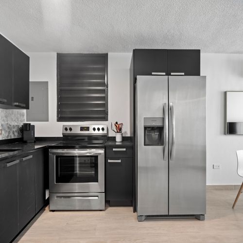 Whip up meals with ease in our sleek, efficient kitchen.