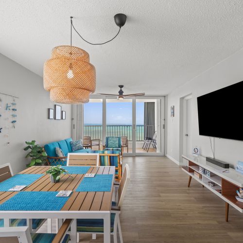 Open concept living with a view! This bright and airy space seamlessly connects the comfortable living area with the dining space, leading directly to a private balcony with stunning outdoor vistas.