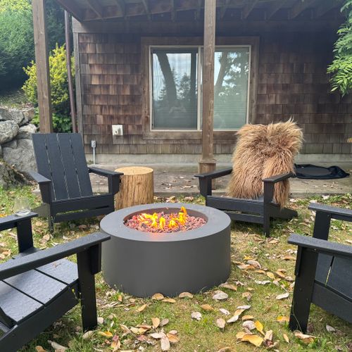 Cozy Fire Pit Evenings – Gather around the warm glow with four comfy chairs, perfect for conversation.