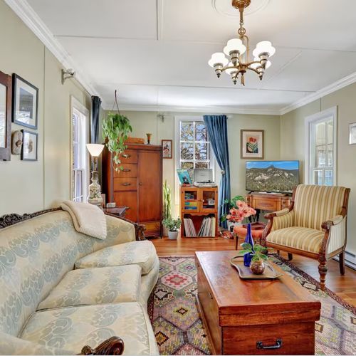 Cozy and comfortable living room with vintage charm and natural light.