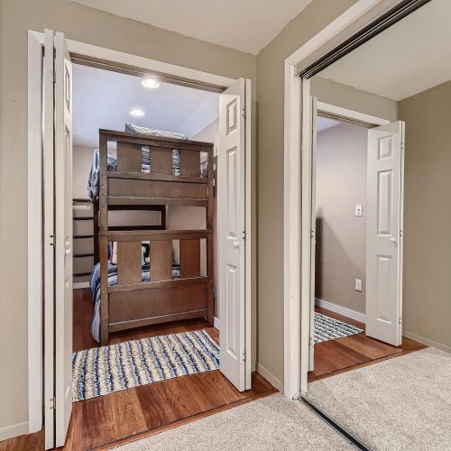 The final bedroom is tucked away downstairs and equipped with another set of twin-sized bunk beds for kids or young adults.