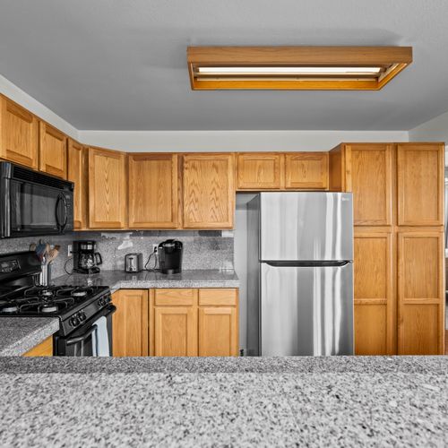 Fully equipped kitchen with stainless appliances and plenty of cabinet and counter space