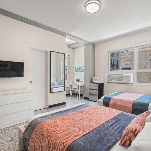 Ideal for friends or family, this room offers two comfortable twin beds.