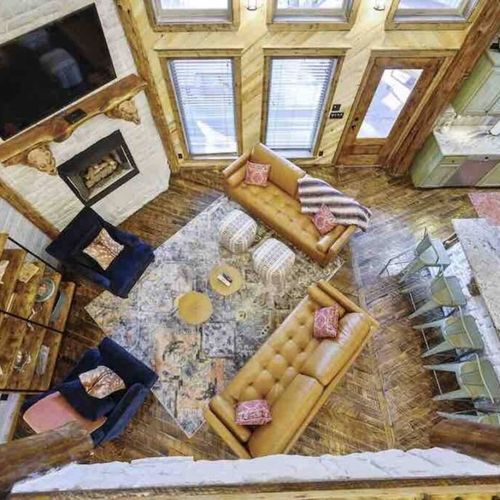 Birds-eye view of the ground level living room and kitchen.