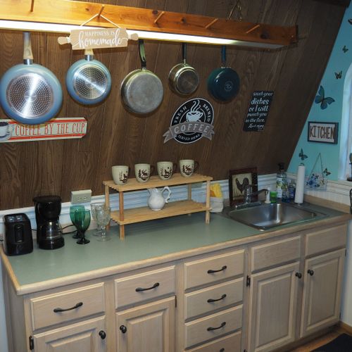 Kitchen:  full kitchen including sink, counter, cabinets, refrigerator, electric range and a good supply of cooking and dining utensils.