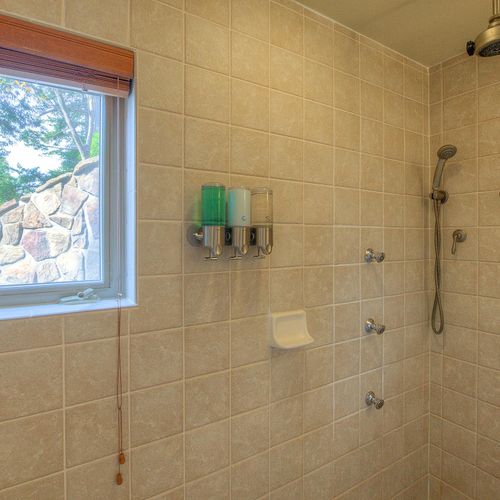 Master Bathroom with rain shower head and wall jets