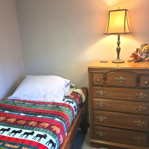 BEDROOM #4 (SECOND FLOOR):  Cute room with 2 twin beds, closet, dresser, and a lamp.