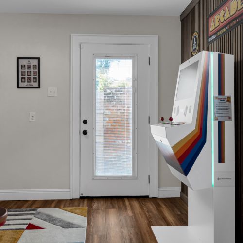 Colorful arcade setup by the entrance — the fun starts before you even settle in.