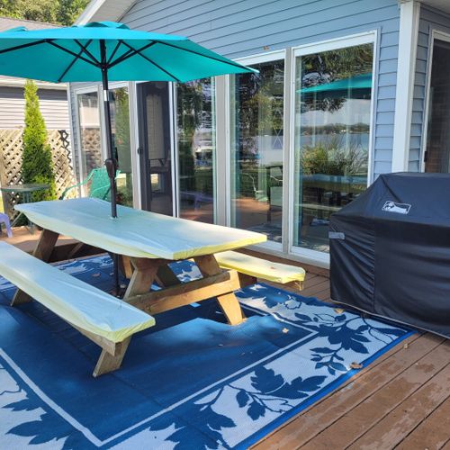 Overall:  the backyard deck with picnic table, umbrella, and gas grill