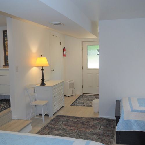 Lower level:   the large lower level basically functions as a third bedroom with 4 single beds via 2 trundle beds (i. E. 2 of the single beds roll up under the other 2 single beds). There is also a desk, two closets, two dressers, and third bathroom.
