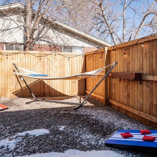 Enjoy an afternoon nap in the hammock or play a game of corn hole!