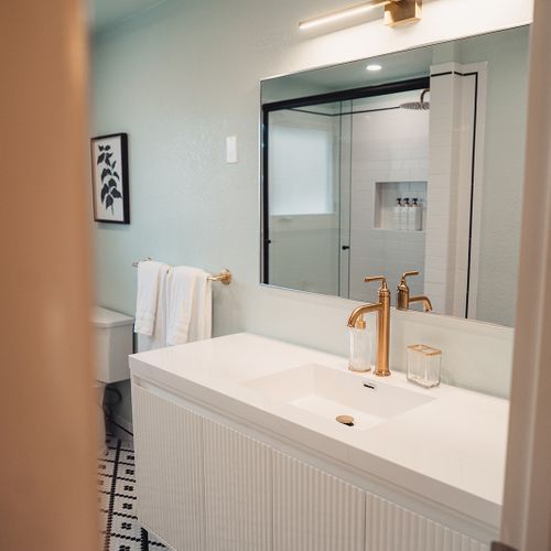 The upstairs bathroom boasts a spacious vanity, providing a touch of luxury and ample space for your daily routine.