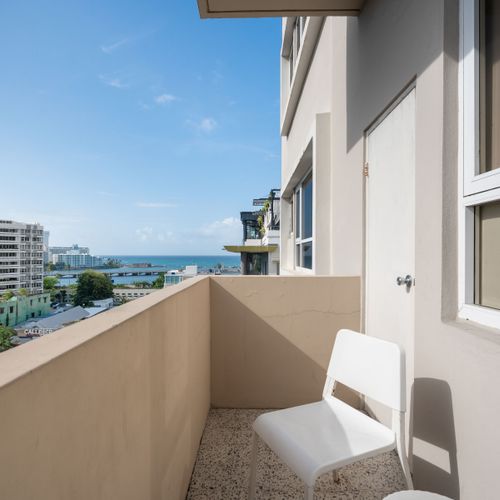 Take in the vibrant surroundings from your private balcony! This view offers a glimpse of the lively neighborhood, perfect for enjoying a morning coffee or an evening breeze.