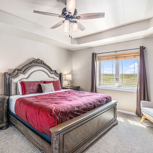The master bedroom boasts a king bed, ensuite bath, and an airy, luxe vibe for a perfect retreat.