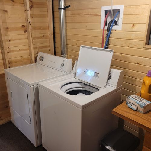 LAUNDRY ROOM:  There is a very convenient laundry room in the basement with a washer, dryer, ironing board, iron, and folding tables.