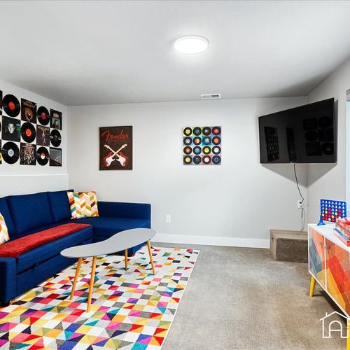Enjoy fun-filled nights in this cozy family room retreat. With plush seating and a large tv, this space is perfect for movie nights and game nights.