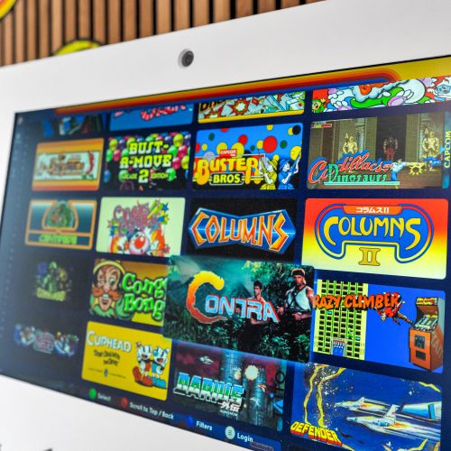 Classic arcade titles line the game room — hours of fun for the whole group.