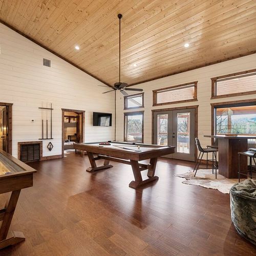 Open game room-Featuring pool table, shuffle board, pub table, and 50 inch TV