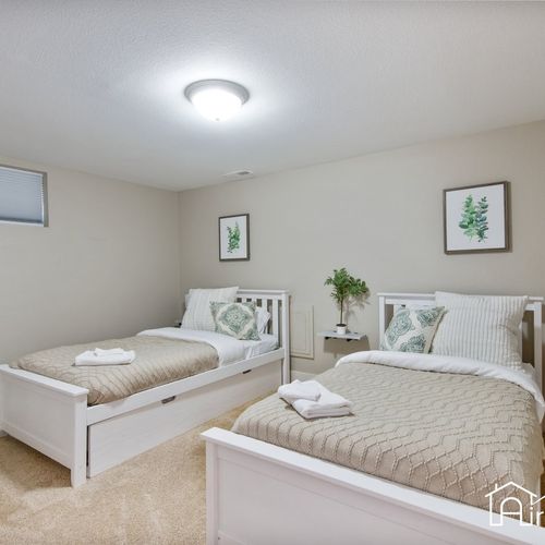 This bedroom finishes the lower level with 2 twin size beds, nightstands, and a closet for added space.