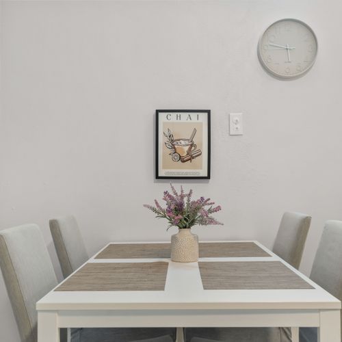 Clean and bright table for dining, work, or games.