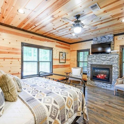 The Master Suite is located on the ground floor, has full bath + patio access.