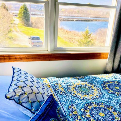 Bedroom #4 (second floor):  features a full-size bed, bunk bed, dresser, chair, and a nice view of betsie lake.