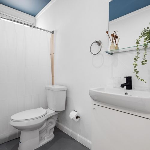 Contemporary Cleanse: Our minimalist-chic bathroom offers a spotless and stylish space for your daily routines, embodying simplicity and sophistication.