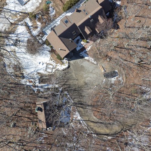 A bird's eye view of the compound at Garrison Woods, with the main house on the right and the guest house on the left.