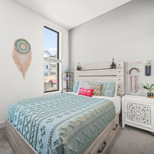 Master bedroom featuring a comfortable queen-size bed.