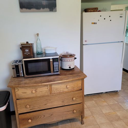 Kitchen:  the home has a large kitchen with a good supply of cooking and dining utensils. Note that there is no dishwasher.