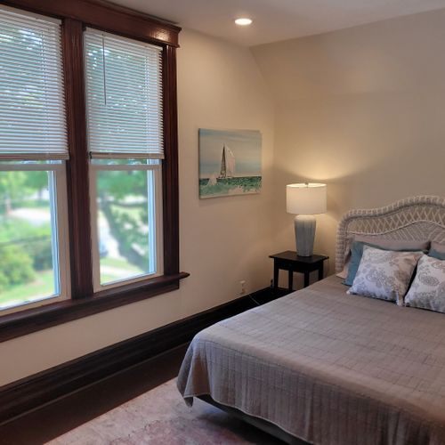 Bedroom #4 (second floor):  features a queen-size bed, dresser, television, nightstands, and a closet.