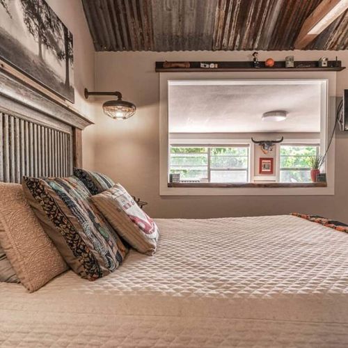 The queen bed comes topped in quality linen and bedding for a restful night’s sleep in the cabin