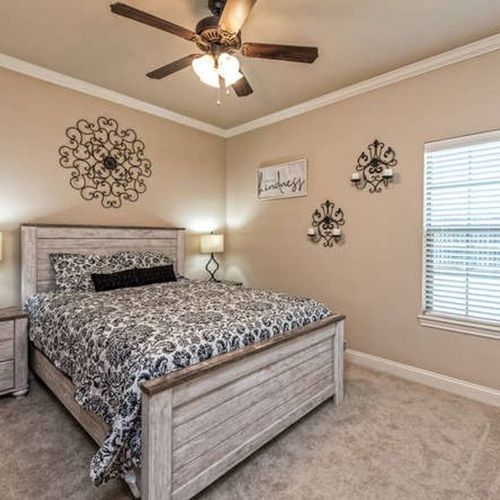 King BR - Unwind in this king bedroom wrapped in comfort and natural light.