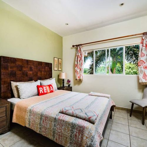 The second bedroom overlooks a beautiful green area