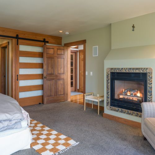 Gas fireplace and reading area in master bedroom
